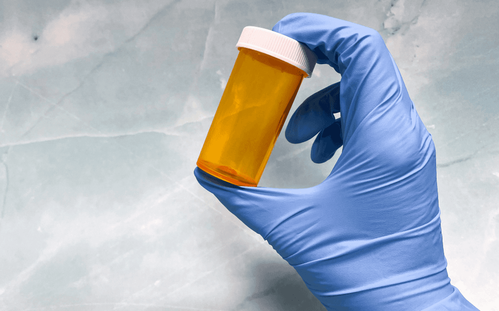 image of pill bottle being held